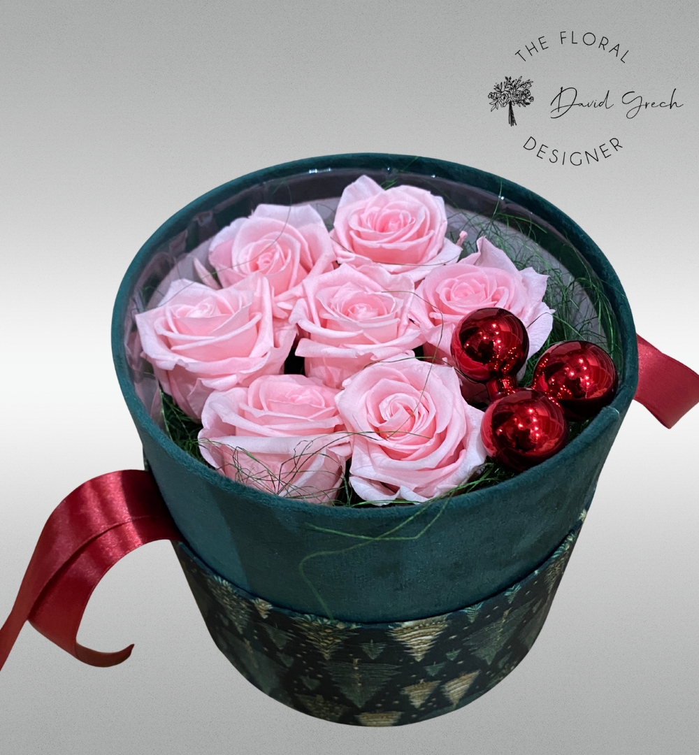 pink preserved roses arranged in an exclusive hat box,..