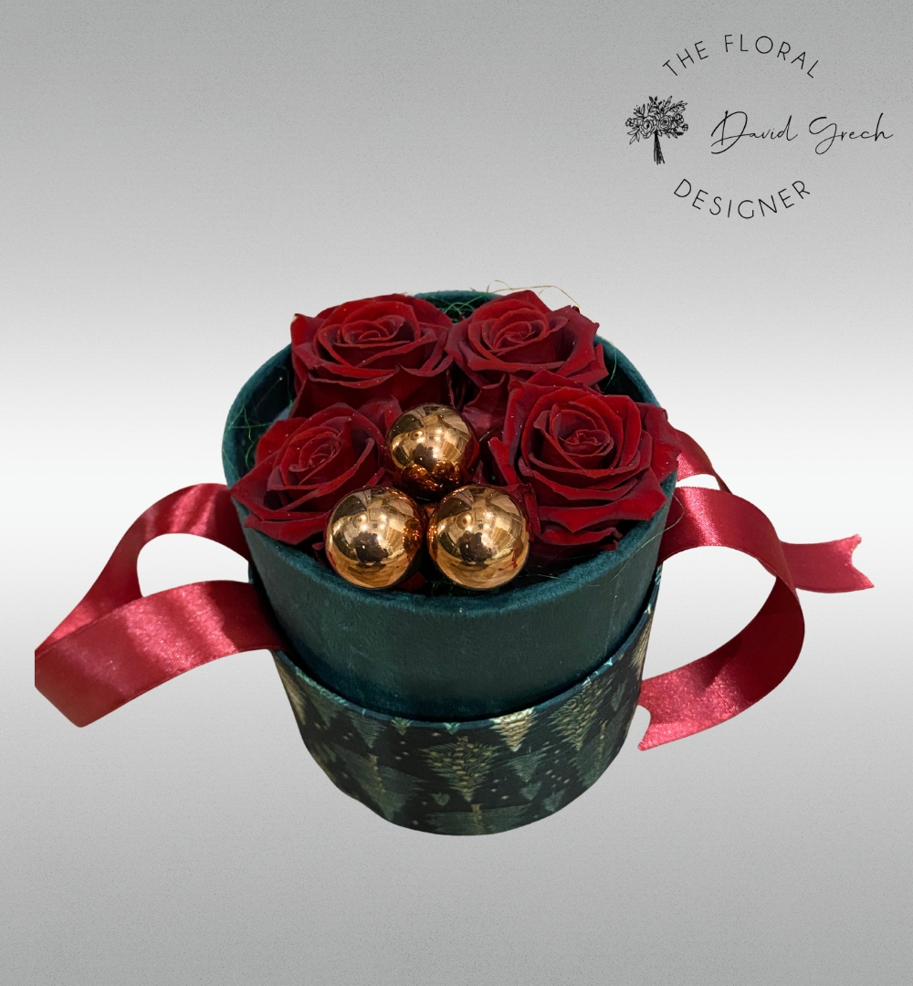 red preserved roses in an elegant hat box.