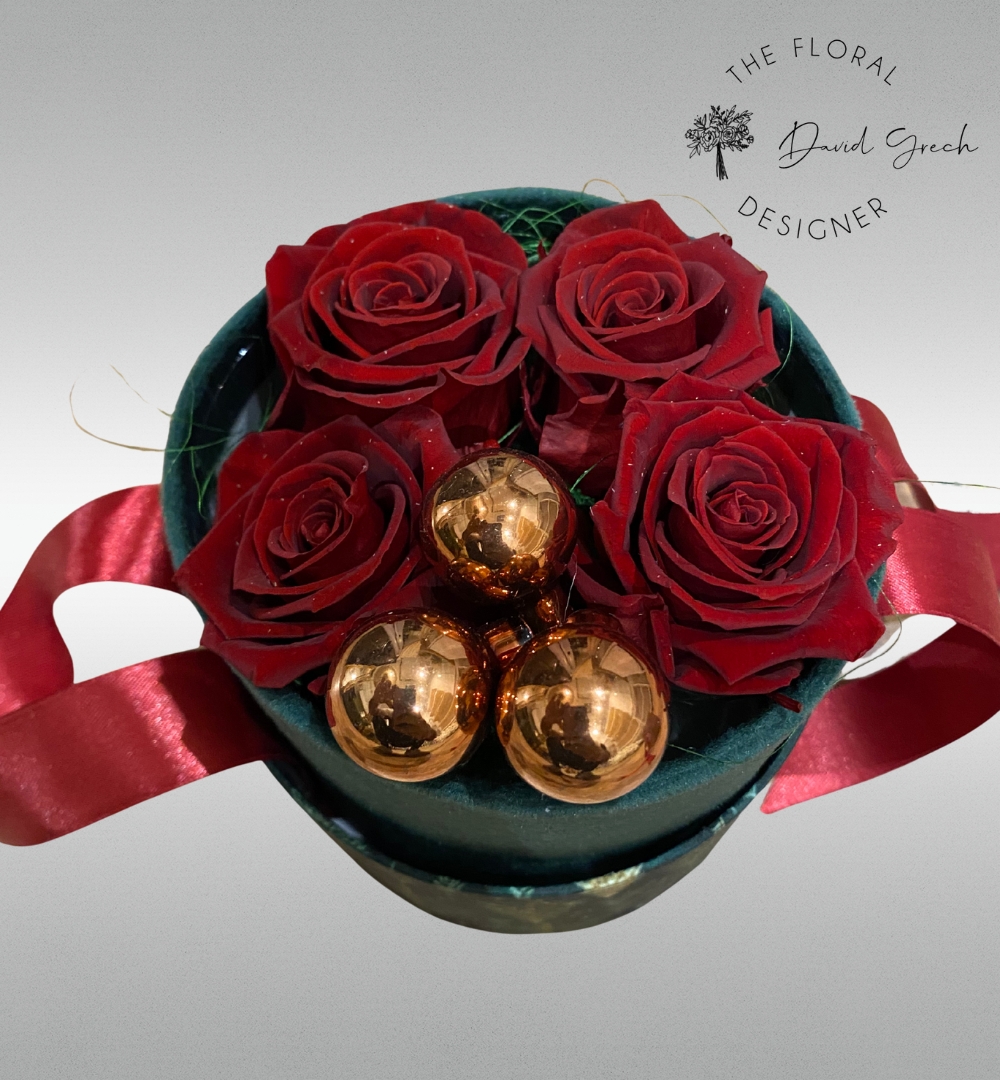 red preserved roses in an elegant hat box..
